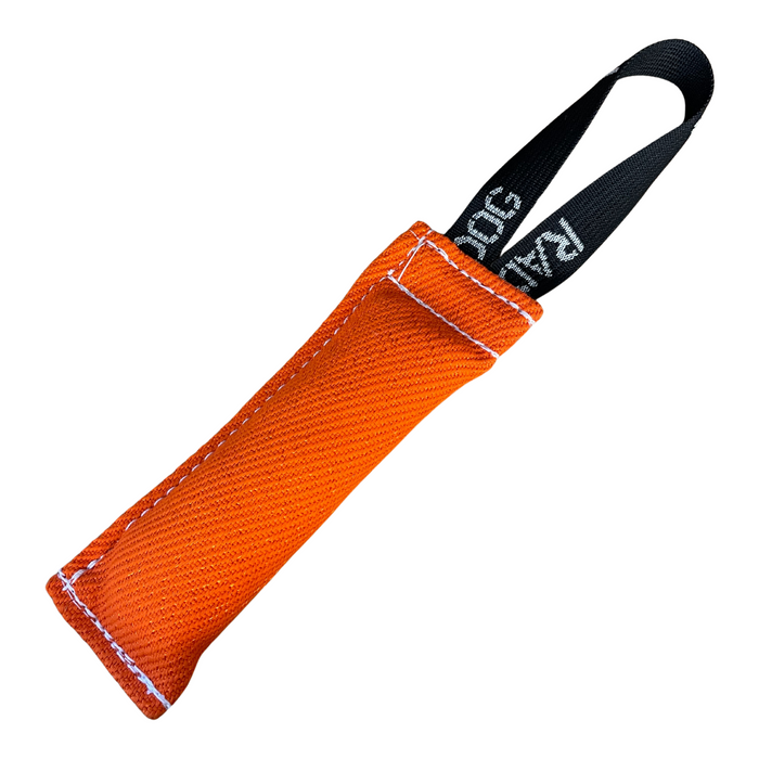 Bright orange padded dog training tug toy with a textured fabric surface, white stitching along the edges, and a black loop handle with white printed text, displayed against a light background.