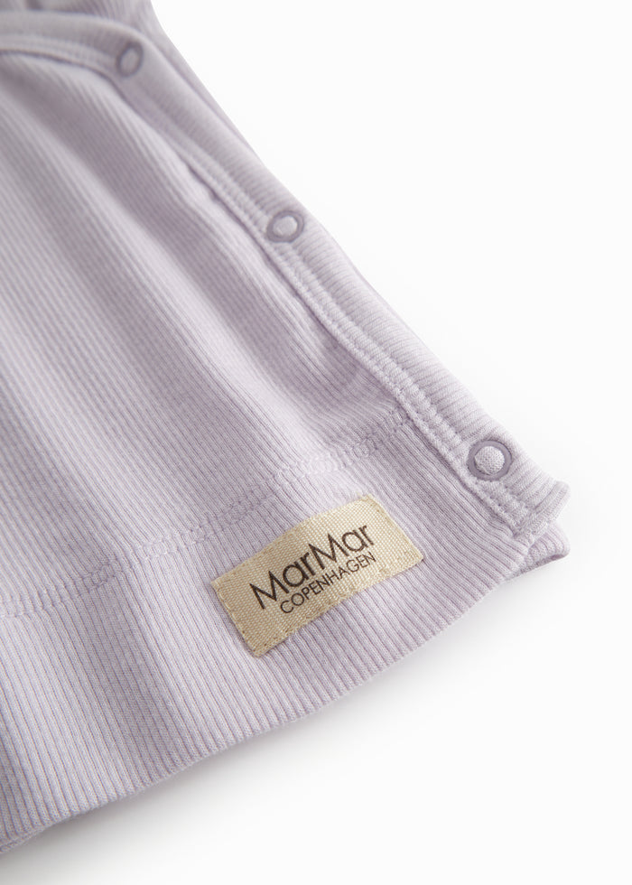 Lightly lined light purple shirt for newborns with a snap closure.