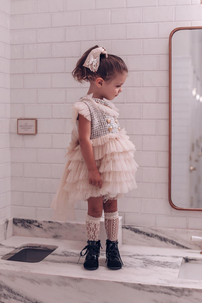 Young girl modeling Champagne Anise Satin Embroidered Hair Bow with butterfly charm