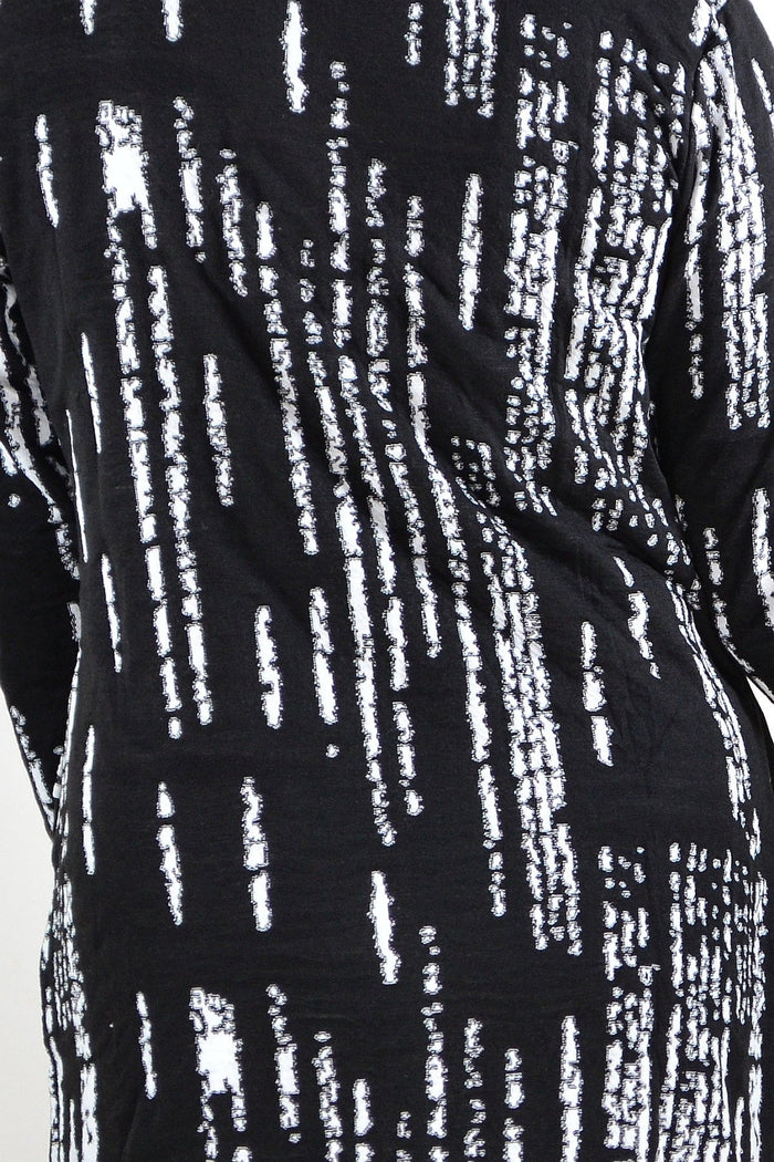 Black and white Shirt Jacket tunic by Hourglass with button details and relaxed fit, displayed on a hanger.