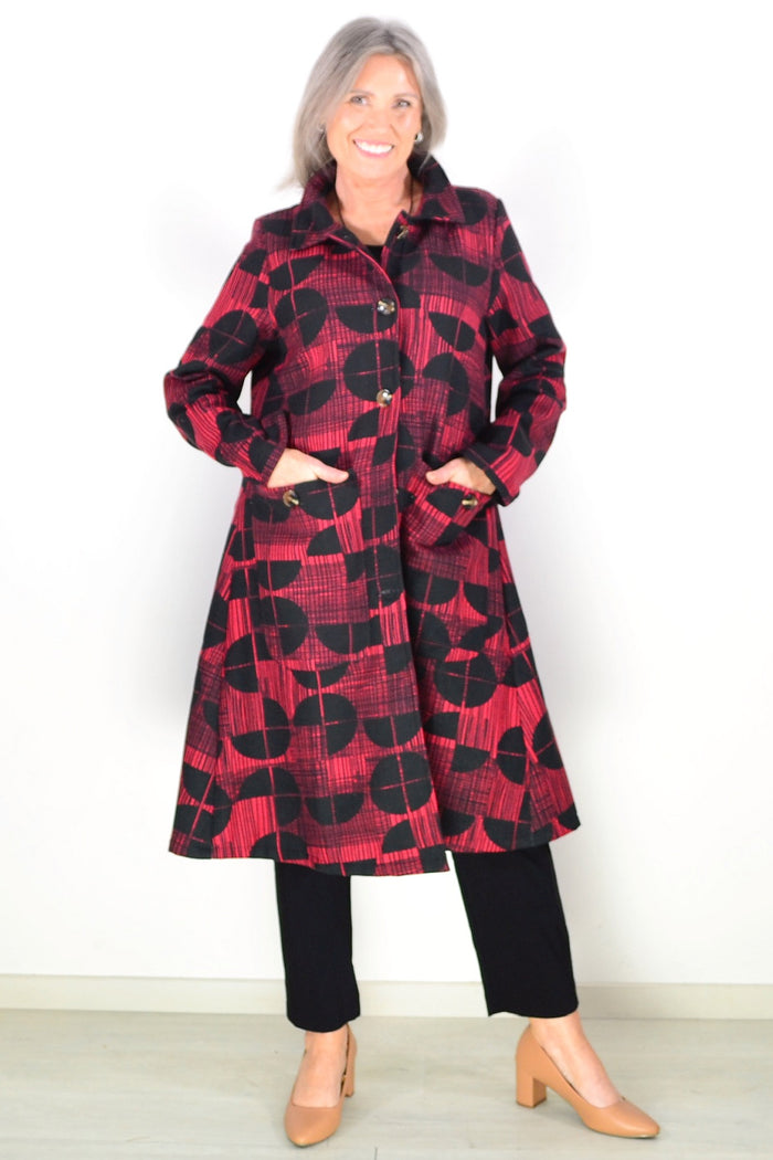 Brick red and black fleece-lined tunic jacket by Hourglass, featuring a cozy, stylish design with visible fleece lining.