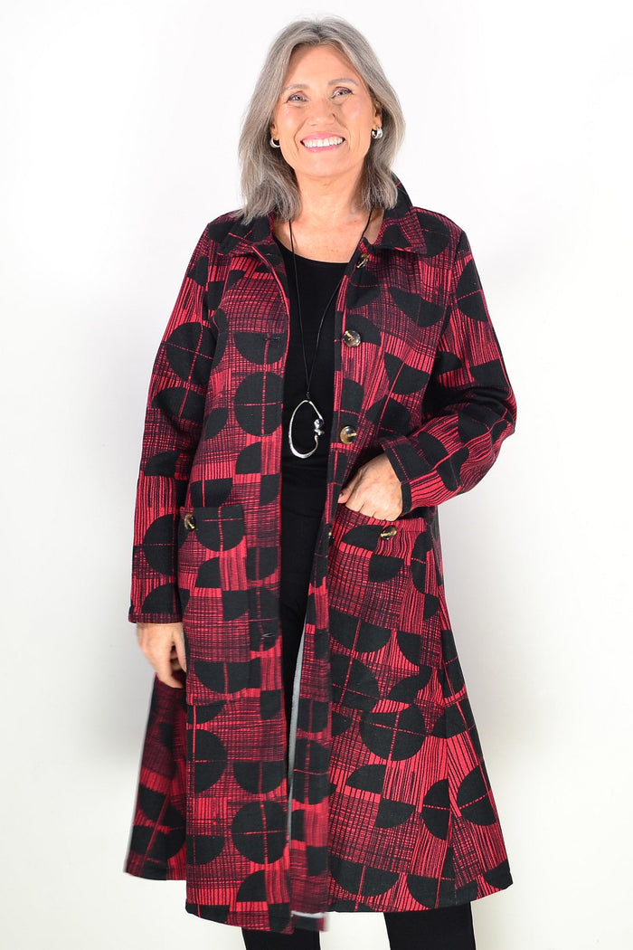 Hourglass brick red and black fleece-lined jacket worn as a tunic, featuring a cozy, warm design with a stylish fit.