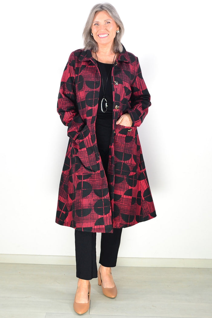 Hourglass brick red black fleece-lined tunic jacket with long sleeves and a cozy, stylish design.