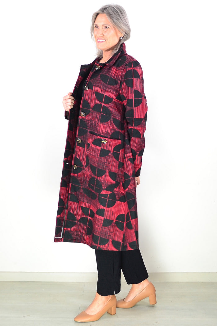 Brick red and black fleece-lined tunic jacket by Hourglass featuring a cozy, casual design and front pockets.