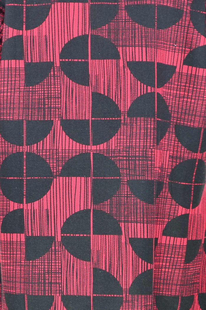 Brick red and black fleece-lined tunic jacket by Hourglass, featuring cozy fabric and stylish design.