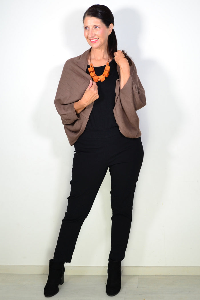 Peony brown travel cardigan wrap draped over a neutral background, showcasing soft fabric and versatile style for travel and casual wear.