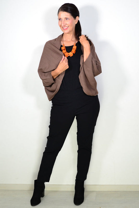 Peony brown travel cardigan wrap draped over a neutral background, showcasing soft fabric and versatile style for travel and casual wear.