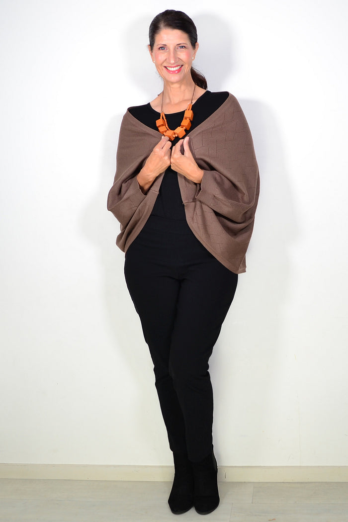 Peony brown travel cardigan wrap draped over a neutral background, showing its soft fabric and versatile design.