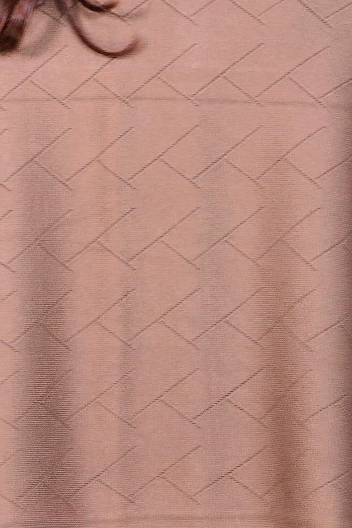Peony brown travel cardigan wrap draped over a surface, showcasing its soft fabric and versatile style for travel and casual wear.