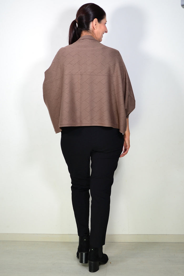 Peony brown travel cardigan wrap draped over a chair, showcasing soft fabric and versatile style for travel and casual wear.