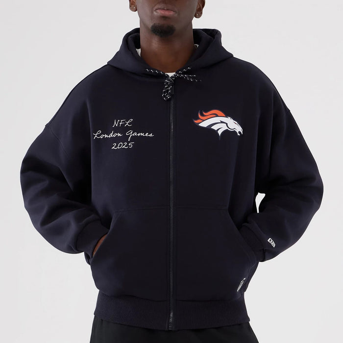 The Male model is wearing Denver Broncos NFL International Series Games 2025 Navy Premium Pullover Hoodie 5