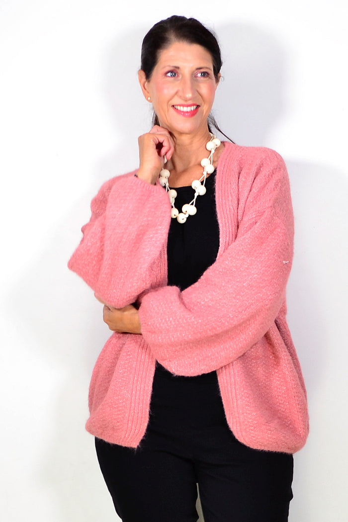 Dusty rose oversized winter cardigan by Sunshine, cozy outerwear with a relaxed fit and chunky knit texture.