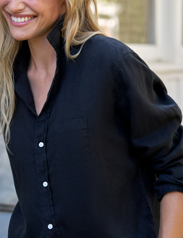 Woman wearing a black shirt with a blurred background