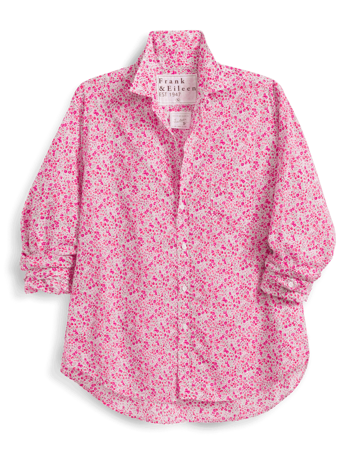 Pink floral shirt with brand label on a black background
