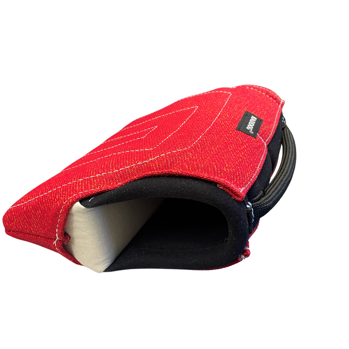 Side view of a red RADDOG Junior Short Sleeve showing the white padded arm entry, black handle, and white reinforced stitching on red Nylcot material.