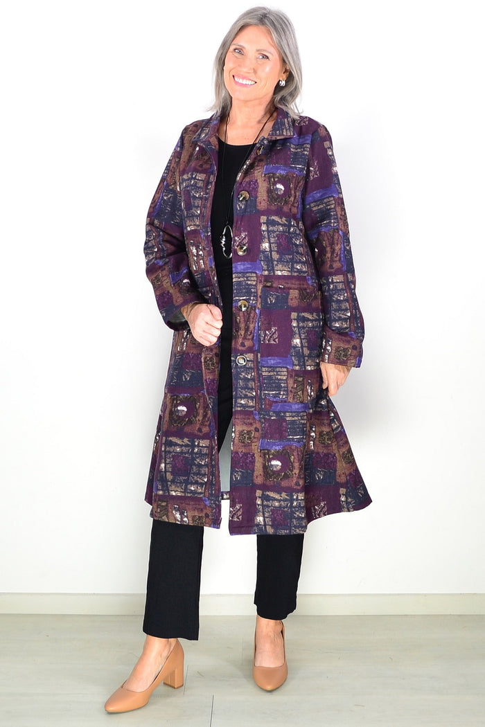 Purple fleece-lined jacket from Hourglass, long tunic style with square pattern, cozy and stylish outerwear for cold weather.