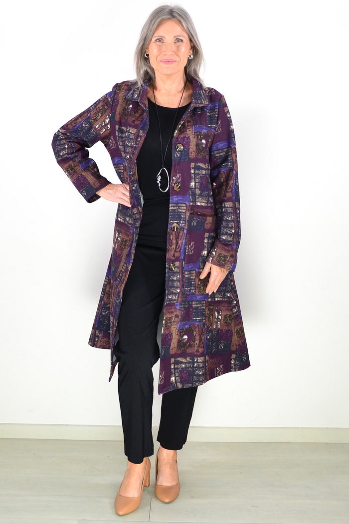 Hourglass long purple squares fleece-lined jacket worn as a tunic, featuring a cozy fleece interior and stylish purple geometric pattern.