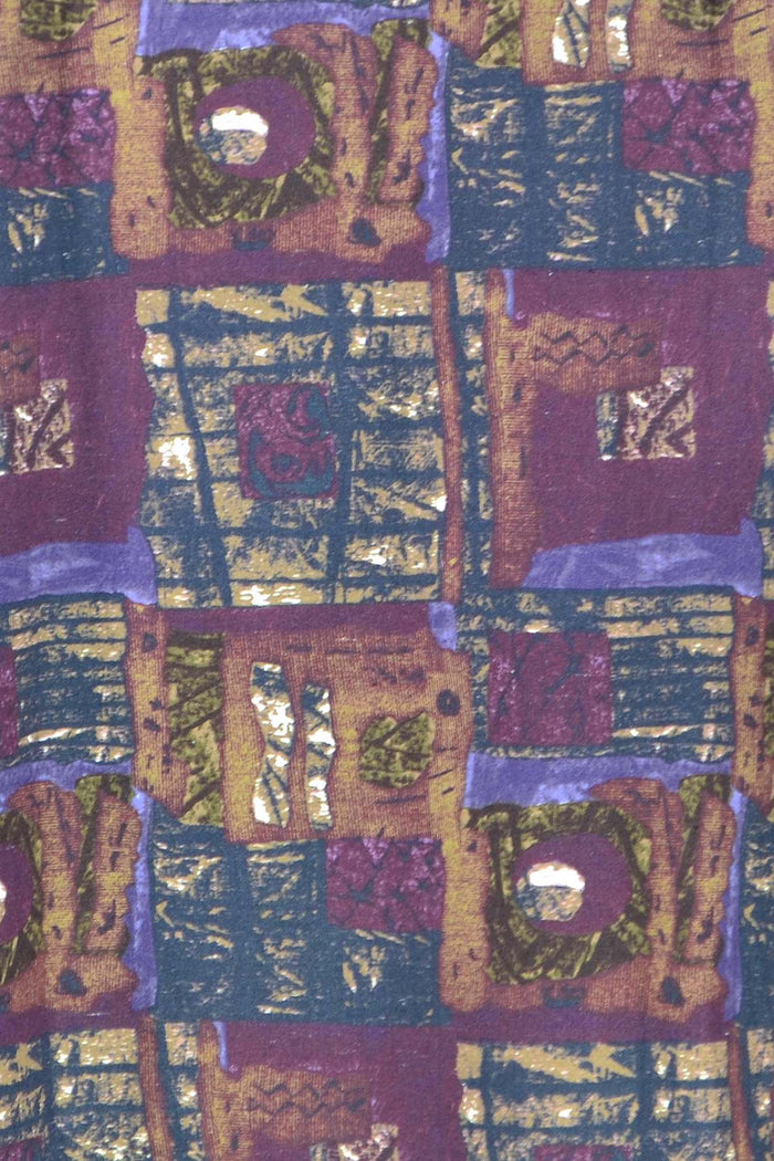 Long purple squares fleece-lined jacket worn as a tunic by Hourglass, featuring a cozy fleece interior and a stylish purple patterned exterior.
