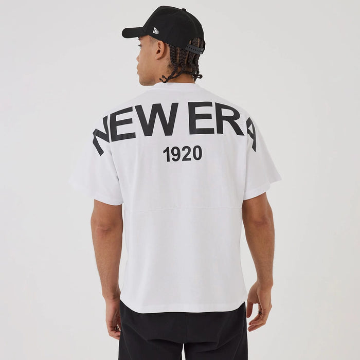 The model is wearing this New Era Distressed T-Shirt in white. 2