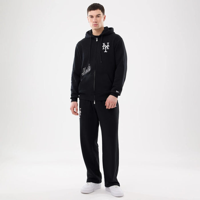 The model is wearing this MLB Comfort New York Mets 2 Way Full Zip Hoodie in black. 8