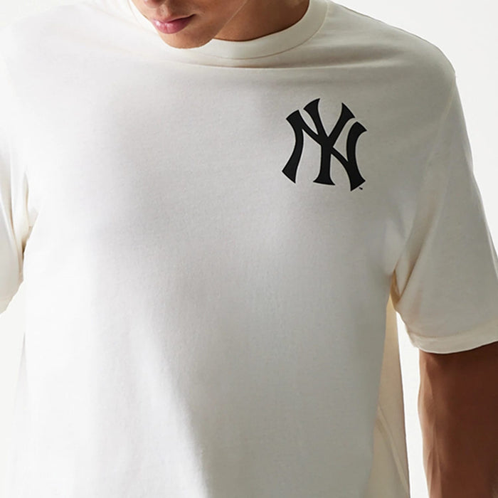The model is wearing this MLB Food Graphic New York Yankees T-Shirt in open white. 6