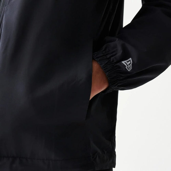 The model is wearing this MLB Reflective Strip New York Yankees Jacket in black. 6