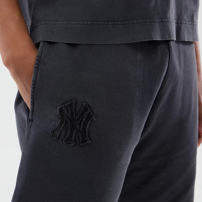 The model is wearing this MLB Washed New York Yankees Shorts in black. 3