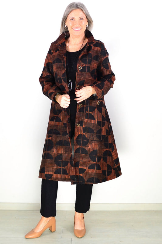 Orange and black fleece-lined tunic jacket by Hourglass, showing a close-up of the cozy, textured fabric and stylish design.
