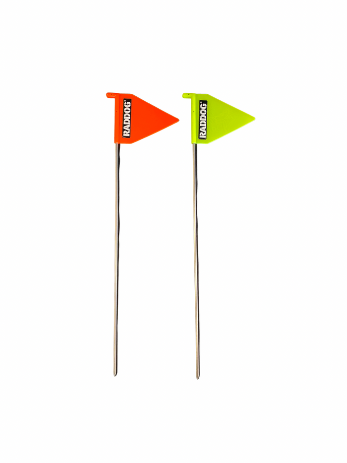 RADDOG IGP tracking stakes with metal rods and high-visibility triangular flags in neon orange and neon yellow for marking track start points in dog training.