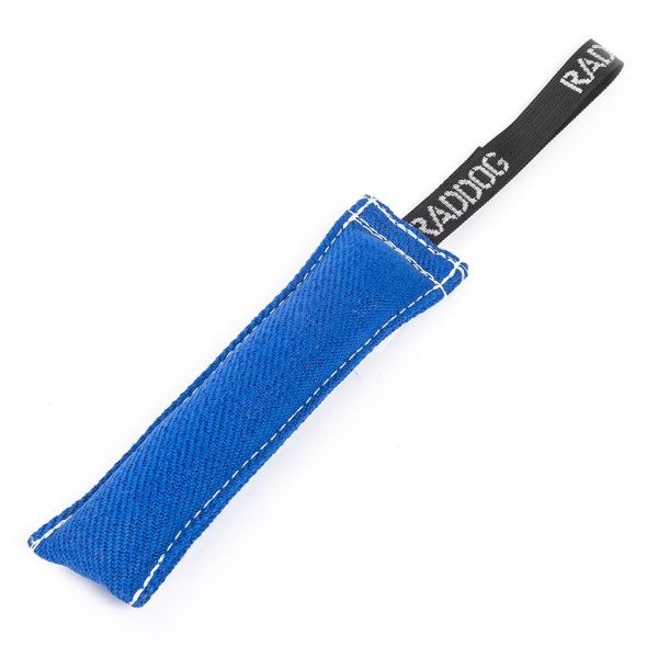 Blue cylindrical dog training tug made of durable textured fabric with reinforced stitching, featuring a black loop handle with “RADDOG” branding on one end.
