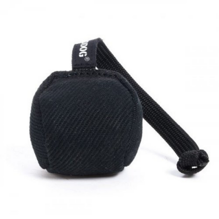 Black fabric-covered dog training ball with a black rope handle and RADDOG label, isolated on a white background.