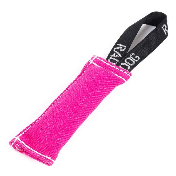 Bright hot pink padded dog training tug toy with a textured fabric surface, white stitching along the edges, and a black loop handle with white printed text, displayed against a light background