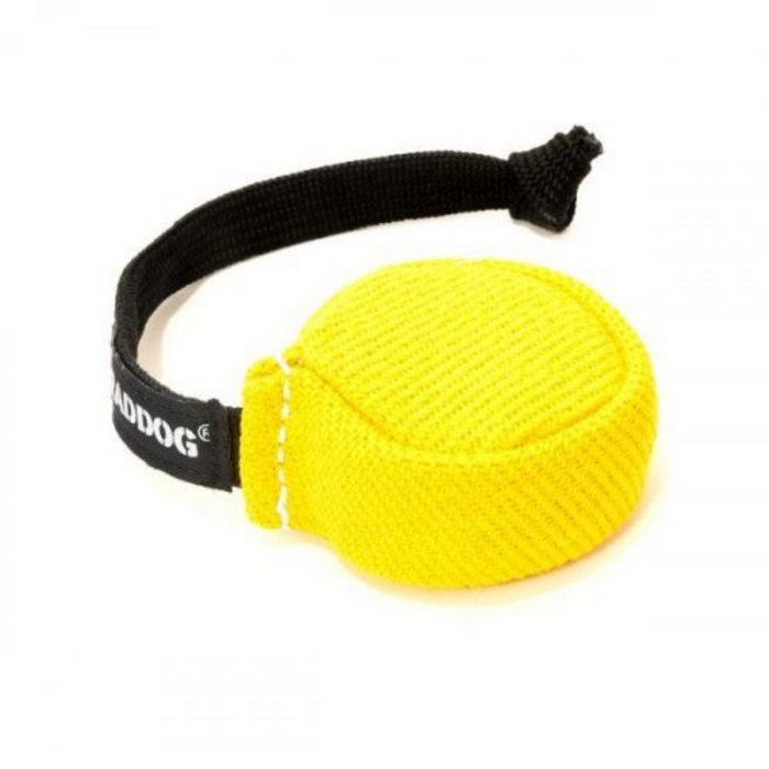 Yellow dog training puck with a textured woven surface and a black braided handle featuring white “RADDOG” branding, isolated on a white background.