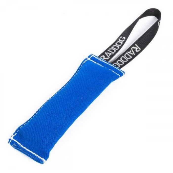 Blue dog training tug toy made of durable fabric with white stitching and a black loop handle labeled “RADDOG,” isolated on a white background.