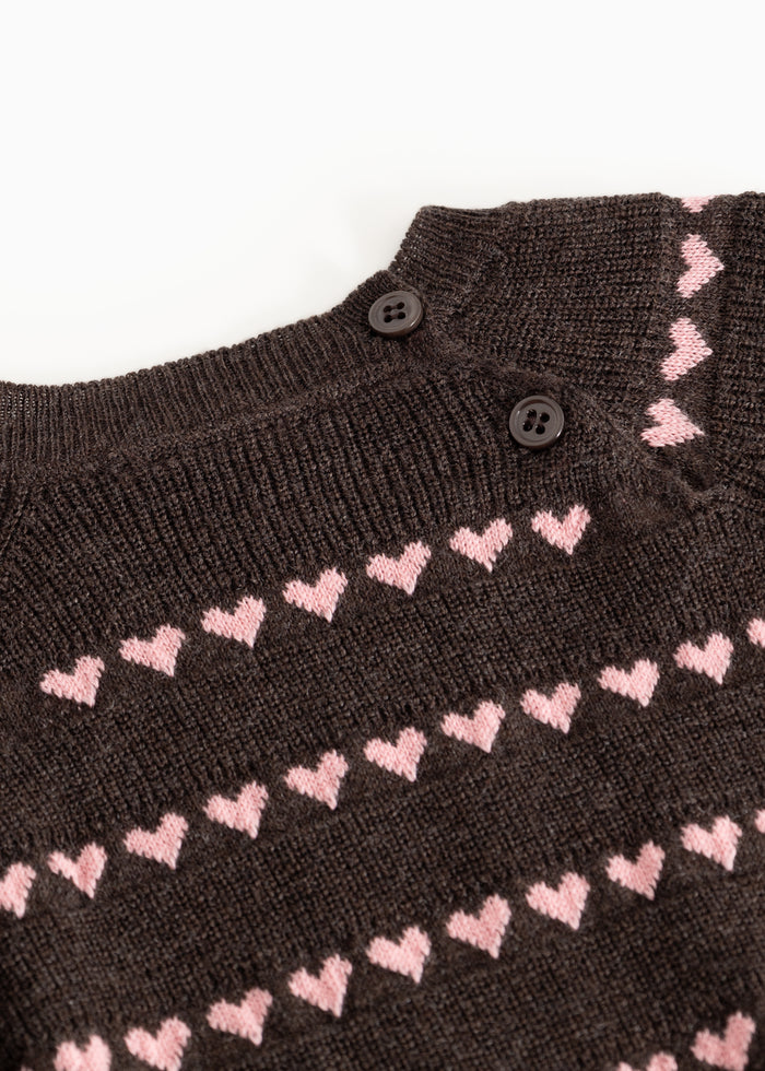 Sort striped blouse with pink hearts and buttons at the neckline.