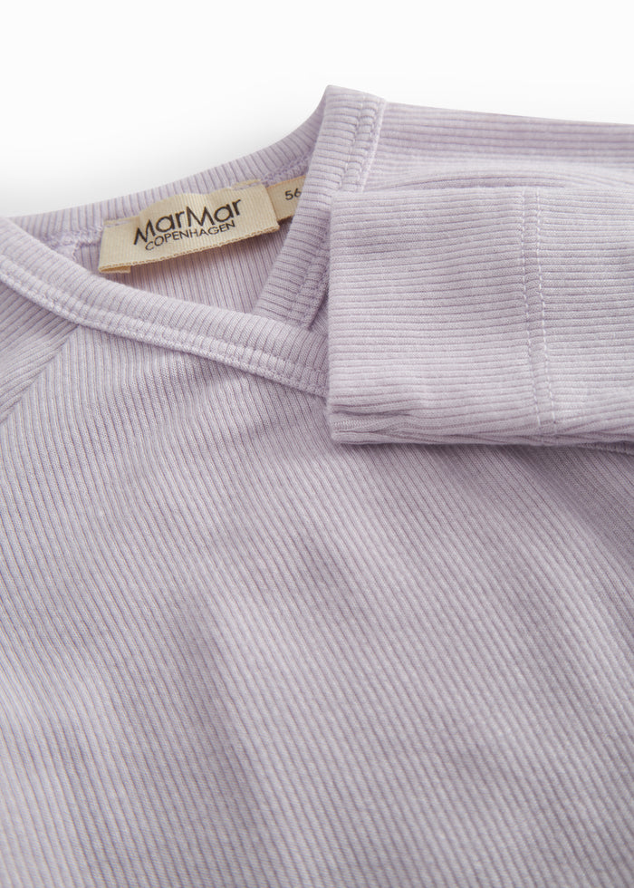Lightly lined light purple shirt for newborns with a snap closure.