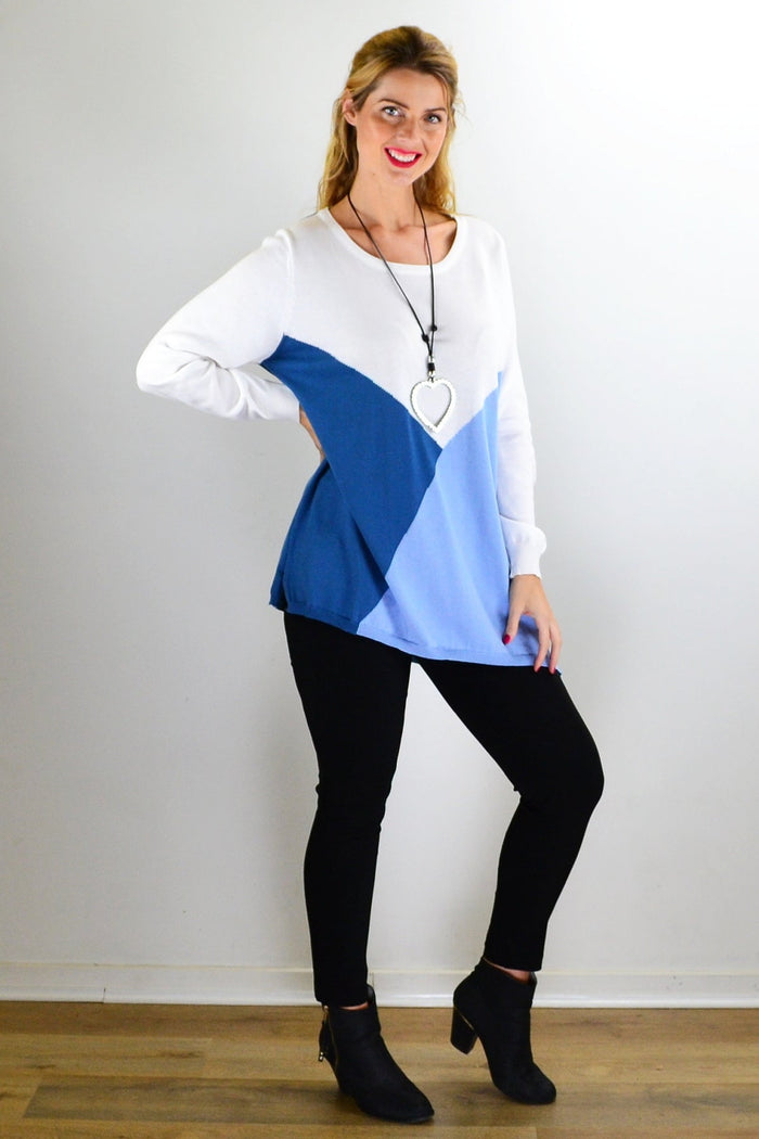 White and blue patchwork pattern jumper, a stylish outerwear piece from I Love Tunics, displayed on a hanger.