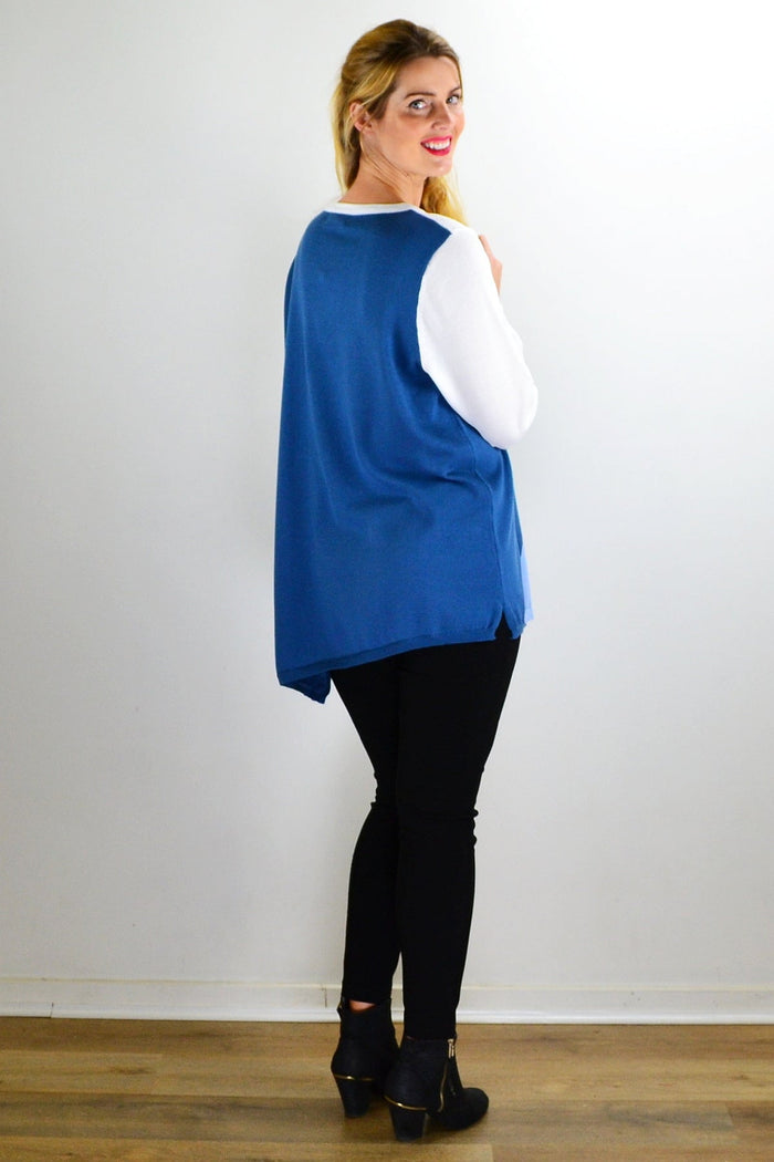White and blue patchwork pattern jumper, outerwear by I Love Tunics, displayed on a hanger with visible knit texture.